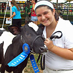 A 4-H'er with a cow.