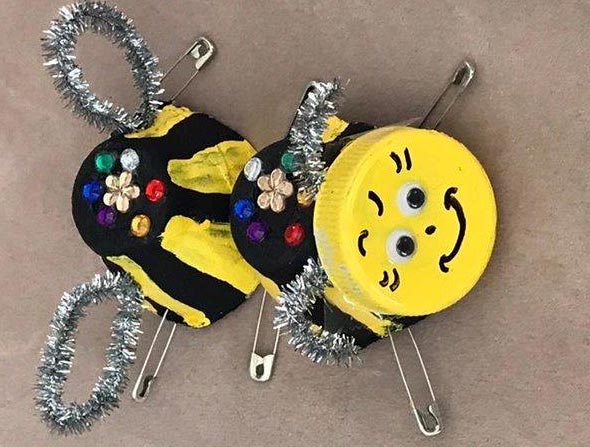 Bumblebee pin made out of recyled materials.